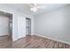 Bedroom features wood floors, white walls, closet, and a white door leading to other rooms at 7632 Spruce Run Ct, Las Vegas, NV 89128