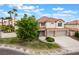 Charming two-story home with a well-manicured lawn, mature landscaping and a convenient two-car garage at 7632 Spruce Run Ct, Las Vegas, NV 89128