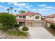 Charming two-story home with a well-manicured lawn, mature landscaping and a convenient two-car garage at 7632 Spruce Run Ct, Las Vegas, NV 89128