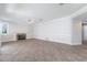 Open living room featuring fireplace, fan, neutral paint, and tile flooring at 7632 Spruce Run Ct, Las Vegas, NV 89128