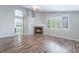 Inviting living room with fireplace, wood floors and plantation shutters for natural light at 7632 Spruce Run Ct, Las Vegas, NV 89128