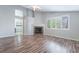 Inviting living room with fireplace, wood floors and plantation shutters for natural light at 7632 Spruce Run Ct, Las Vegas, NV 89128