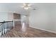 Large bonus loft with wood flooring, modern lighting, and ample space for entertaining or relaxing at 7632 Spruce Run Ct, Las Vegas, NV 89128