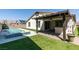 An outdoor patio and a plunge pool area in the backyard, perfect for relaxation at 7821 Mazarine St, North Las Vegas, NV 89084
