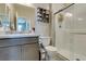 A bathroom featuring a single sink vanity with a shower over the commode at 7821 Mazarine St, North Las Vegas, NV 89084
