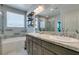 Bathroom featuring a double sink and a shower over bath at 7821 Mazarine St, North Las Vegas, NV 89084