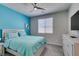 Cozy bedroom featuring a bright accent wall and a comfortable bed at 7821 Mazarine St, North Las Vegas, NV 89084