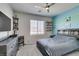Bedroom featuring TV, shelving and modern decor with two-tone blue paint at 7821 Mazarine St, North Las Vegas, NV 89084