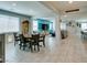 Dining room with open layout, tile flooring, and easy access to the kitchen and living spaces, perfect for entertaining at 7821 Mazarine St, North Las Vegas, NV 89084