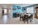 Open dining area featuring tile floors and with access to the hallway at 7821 Mazarine St, North Las Vegas, NV 89084