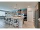 Large kitchen with stainless steel appliances, wine storage, and an open layout concept at 7821 Mazarine St, North Las Vegas, NV 89084