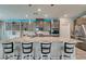 Well-appointed kitchen featuring a large island with seating, stainless appliances, and a pantry at 7821 Mazarine St, North Las Vegas, NV 89084