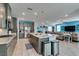 Open kitchen with granite countertops, stainless steel appliances, and an island at 7821 Mazarine St, North Las Vegas, NV 89084