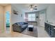 Comfortable living area with a large couch, window, and stylish decor at 7821 Mazarine St, North Las Vegas, NV 89084