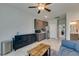 Open living space with kitchenette, modern decor, and plenty of light at 7821 Mazarine St, North Las Vegas, NV 89084