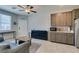 Open living space with kitchenette, modern decor, and ample lighting at 7821 Mazarine St, North Las Vegas, NV 89084