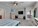 Spacious main bedroom features a ceiling fan, ensuite bathroom, and walk-in closet at 7821 Mazarine St, North Las Vegas, NV 89084