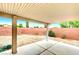 Enclosed backyard patio, providing a private outdoor space for relaxing or entertaining with a brick wall and gravel ground cover at 8120 Backpacker Ct, Las Vegas, NV 89131