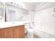 Clean bathroom with a wood vanity, single sink, large mirror, and shower over tub combination at 8120 Backpacker Ct, Las Vegas, NV 89131