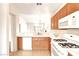 Bright kitchen with wood cabinets, white countertops, and modern appliances, perfect for cooking and entertaining at 8120 Backpacker Ct, Las Vegas, NV 89131