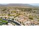 Expansive aerial view of desert community with mountain backdrop, offering serene living at 8180 Loma Del Ray St, Las Vegas, NV 89131