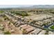 Panoramic aerial showing a neighborhood with pools, solar panels, and mountain scenery at 8180 Loma Del Ray St, Las Vegas, NV 89131