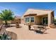 Seating area in landscaped backyard with stucco wall and custom landscape at 8180 Loma Del Ray St, Las Vegas, NV 89131
