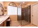 Bathroom featuring a glass enclosed shower and a vanity with marble countertop at 8180 Loma Del Ray St, Las Vegas, NV 89131