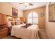 Bedroom with wood furniture, decorative window shutter and neutral color palette at 8180 Loma Del Ray St, Las Vegas, NV 89131