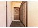 Inviting front entryway features an ornate security gate and decorative wreath on the brown door at 8180 Loma Del Ray St, Las Vegas, NV 89131