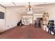 Spacious two-car garage with ample storage space, workbench, and painted floor at 8180 Loma Del Ray St, Las Vegas, NV 89131