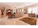 Comfortable living room with fireplace, ceiling fan, and ample natural light at 8180 Loma Del Ray St, Las Vegas, NV 89131