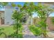 A picturesque backyard with a charming garden archway leading to a patio, perfect for relaxation and entertaining at 8349 Pollenzo Ave, Las Vegas, NV 89178