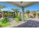 Landscaped backyard featuring a stone pathway and lush green grass at 8349 Pollenzo Ave, Las Vegas, NV 89178