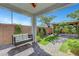 Charming backyard with a covered patio swing and beautifully landscaped yard at 8349 Pollenzo Ave, Las Vegas, NV 89178