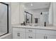 Bright bathroom featuring double sinks with modern fixtures and a glass-enclosed shower at 8349 Pollenzo Ave, Las Vegas, NV 89178