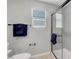 Modern bathroom with a glass shower door and window with bright natural light at 8349 Pollenzo Ave, Las Vegas, NV 89178