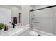 Modern bathroom with walk-in shower, black hardware, and quartz countertops at 8349 Pollenzo Ave, Las Vegas, NV 89178