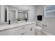 Bathroom with double sink, white countertops, and sleek black hardware at 8349 Pollenzo Ave, Las Vegas, NV 89178