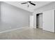 Bedroom featuring tile floors, a ceiling fan, and a closet with sliding doors at 8349 Pollenzo Ave, Las Vegas, NV 89178