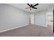 Inviting bedroom with soft carpeting and a stylish ceiling fan at 8349 Pollenzo Ave, Las Vegas, NV 89178