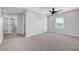 Spacious carpeted bedroom with ceiling fan, and natural light at 8349 Pollenzo Ave, Las Vegas, NV 89178