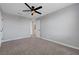 Comfortable bedroom with plush carpet and contemporary ceiling fan at 8349 Pollenzo Ave, Las Vegas, NV 89178