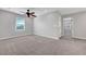 Carpeted primary bedroom with ceiling fan and great natural light at 8349 Pollenzo Ave, Las Vegas, NV 89178