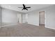 Spacious carpeted bedroom featuring a modern ceiling fan and ample natural light at 8349 Pollenzo Ave, Las Vegas, NV 89178