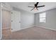 Bright bedroom with carpet floors and a modern ceiling fan at 8349 Pollenzo Ave, Las Vegas, NV 89178