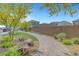 A landscaped community park with seating, walkways, and lush greenery, offering a serene outdoor retreat at 8349 Pollenzo Ave, Las Vegas, NV 89178