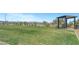 Community park offers a refreshing open space for activities, featuring a shaded picnic area and green grass at 8349 Pollenzo Ave, Las Vegas, NV 89178