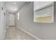 Hallway with tile floors leading to a bedroom and the front door at 8349 Pollenzo Ave, Las Vegas, NV 89178