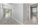 Hallway with tile floors looking into the living area and a bedroom at 8349 Pollenzo Ave, Las Vegas, NV 89178